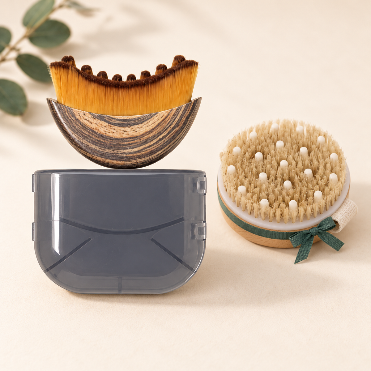 Face brush and case with the free body brush tied with a green ribbon